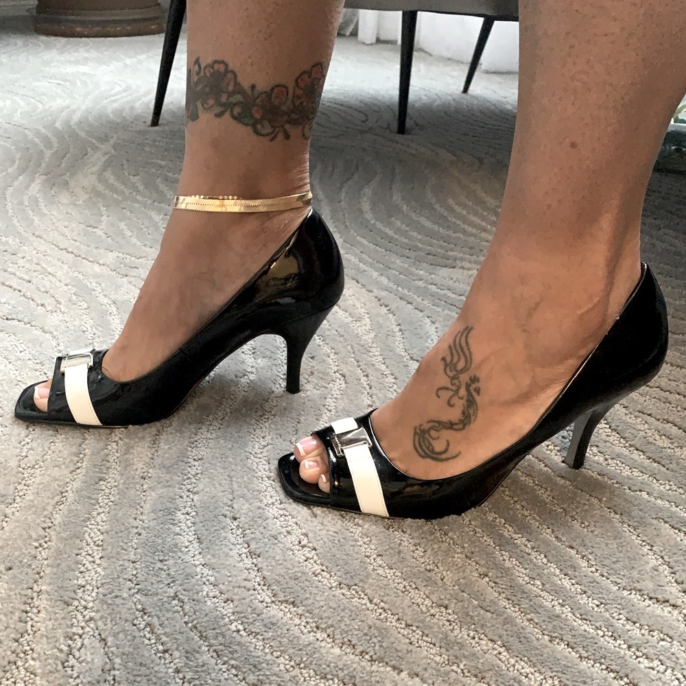 Women’s black and white patent leather open toe heels by TAHARI.
